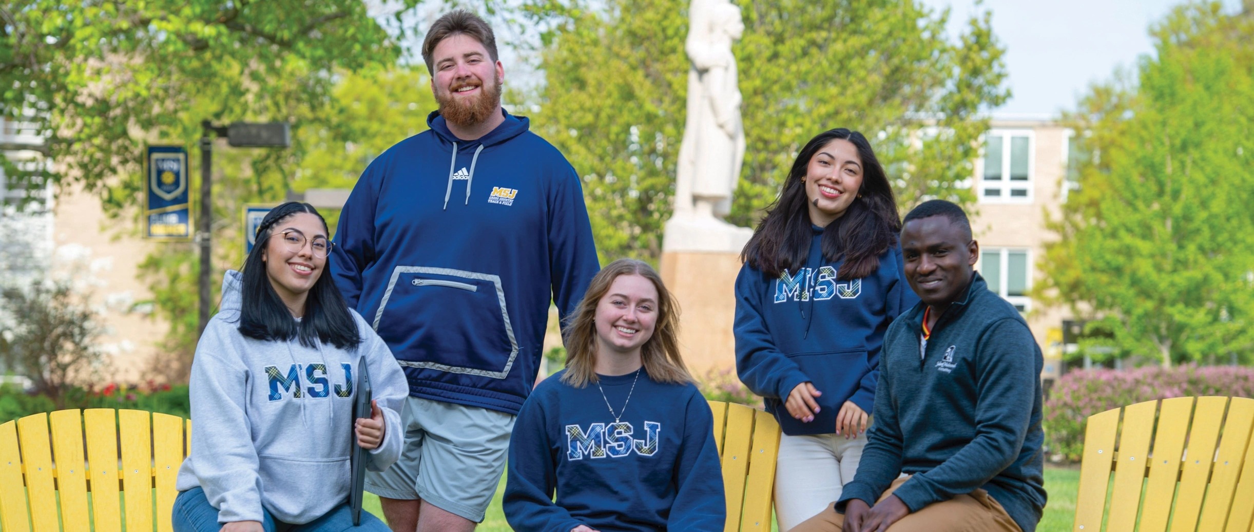 students sitting in a circle outside