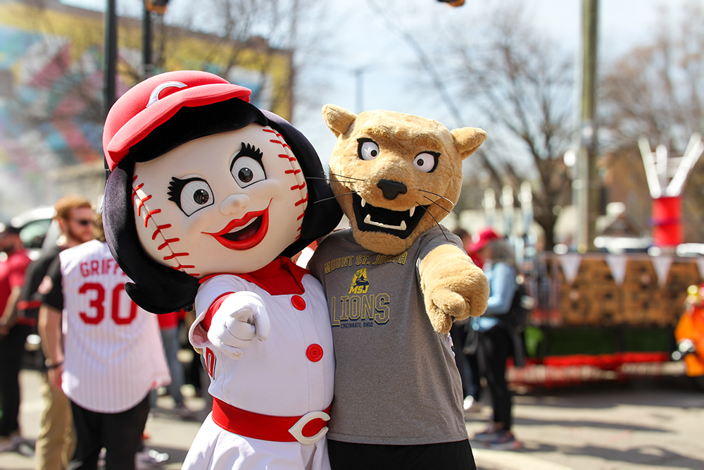 Joe the Lion mascot in front of crowd