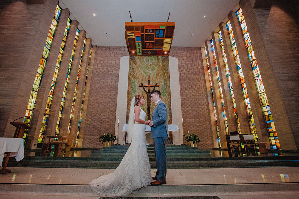 kelsey and anthony at mater dei chapel altar