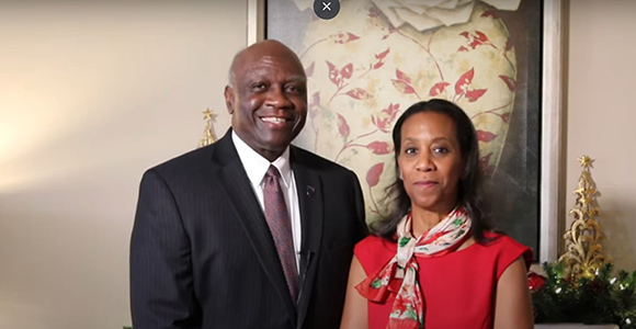 Mount St. Joseph University president h. james and Mrs. Williams smiling for christmas season.