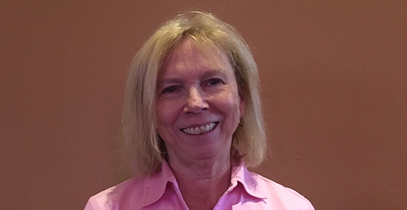 alumni board member terri schumacher smiling in profile photo.
