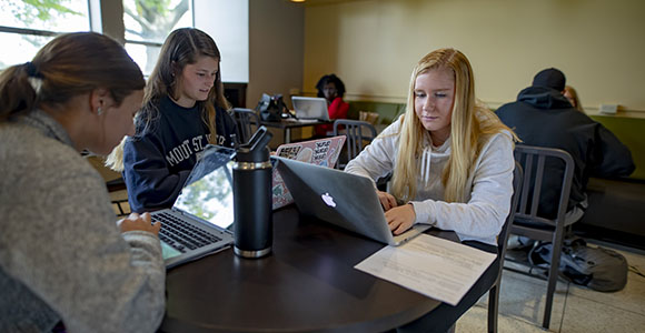 Mount St. Joseph University students on laptops at starbucks