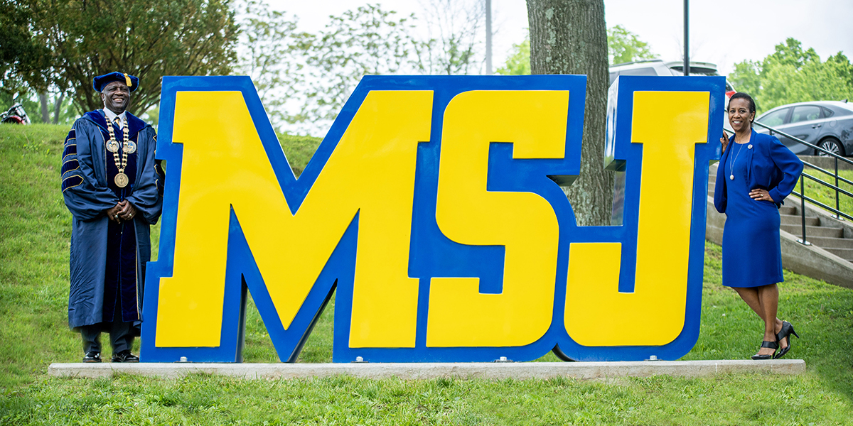 dr. williams and mrs. williams standing next to MSJ letters.