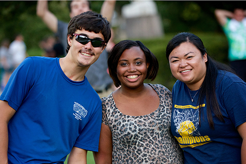 students smiling outside